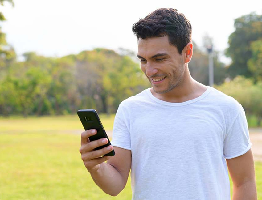 Man using his phone to contact an orthodontic office in Bend