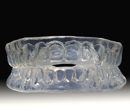 Clear trays to be worn over the teeth