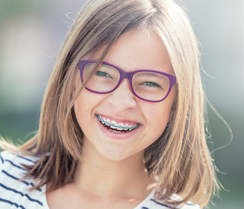 Girl with braces grinning