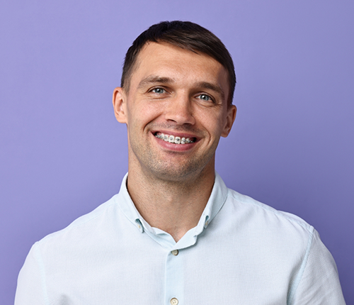 Smiling man with braces